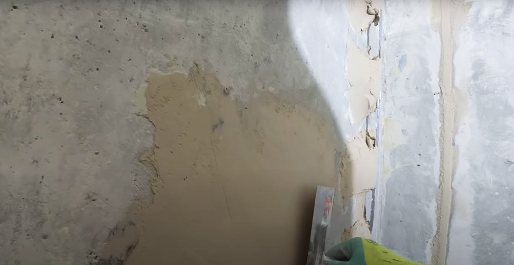 Fill any cracks or holes in the wall with spackle