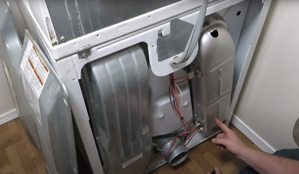 Remove the screws on the back of the dryer and remove the back panel